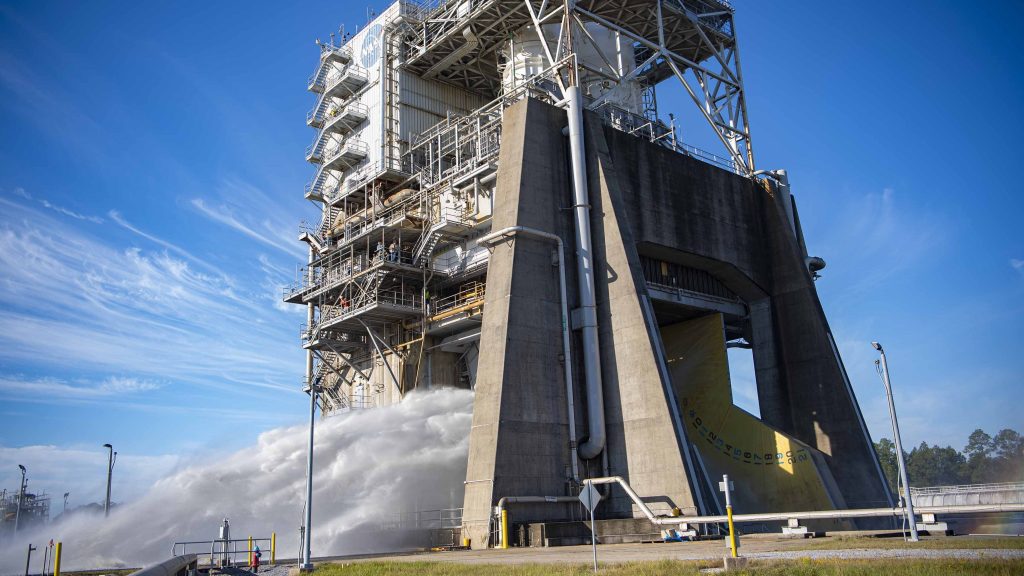 steam and water erupt during water flow system flush on the Fred Haise Test Stand