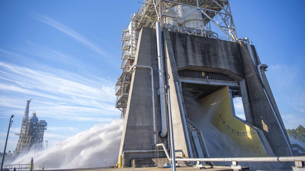 steam and water erupt during water flow system flush on the Fred Haise Test Stand