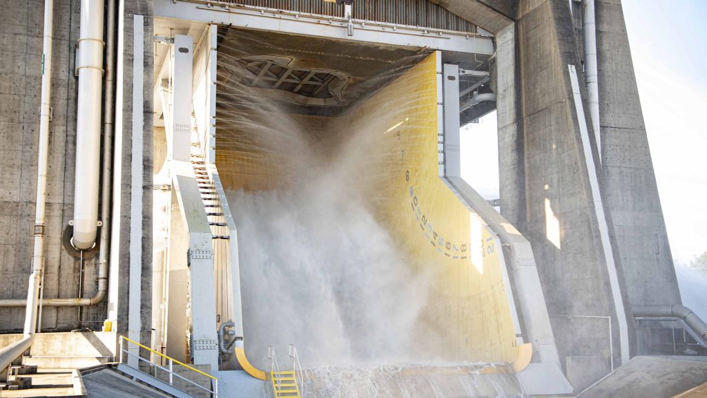 steam and water erupt during water flow system flush on the Fred Haise Test Stand