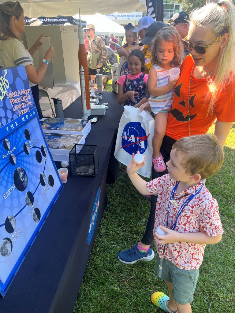 Young participants playing a game to identify different phases of the Moon and learned more about NASA’s return to the Moon at the Wild Things event celebrating National Wildlife Refuge Week in Lacombe, Louisiana.