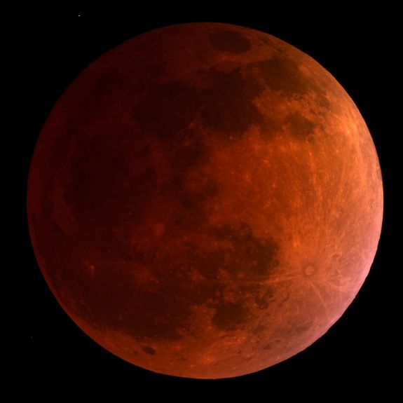 he moon turns blood red in this 3:30 a.m. ET view of the total lunar eclipse on April 15, 2014 as seen by a telescope at the University of Arizona's Mt. Lemmon SkyCenter at Steward Observatory atop Mt. Lemmon, Arizona.