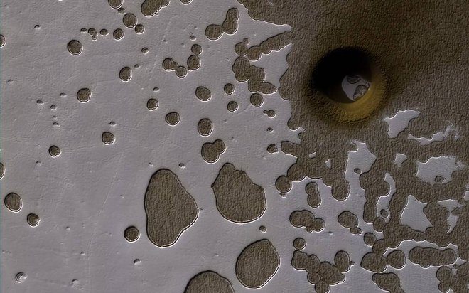 Mars Crater or Collapse? A Photo Mystery in Martian 'Swiss Cheese'
